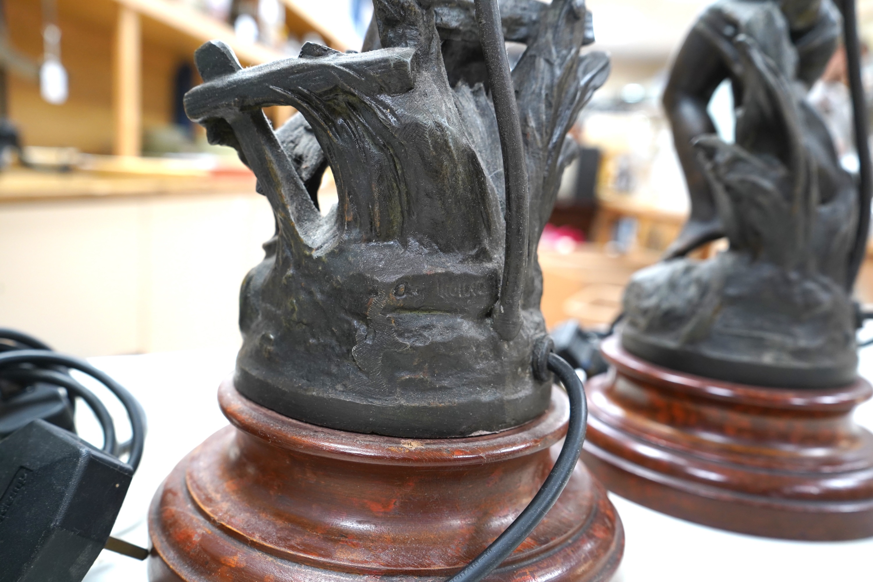 A pair of Art Nouveau style bronzed lady table lamps and glass shades, 48cm including shades and sands